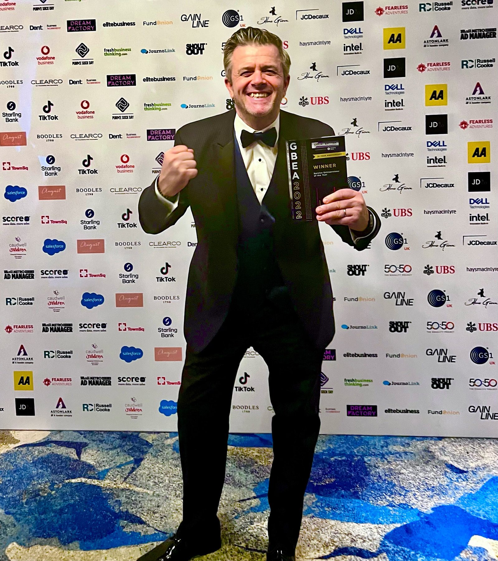 Mark Conacher receiving a Great British Entrepreneur Award in 2022